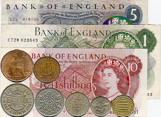Pre-decimal currency Circa 1960s. Showing five pound, one pound and ten shilling note and a penny, halfpenny, half-crown, florin, shilling, sixpence and threppeny bit.